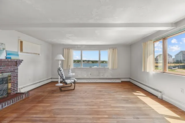 a view of a room with gym equipment and a large window
