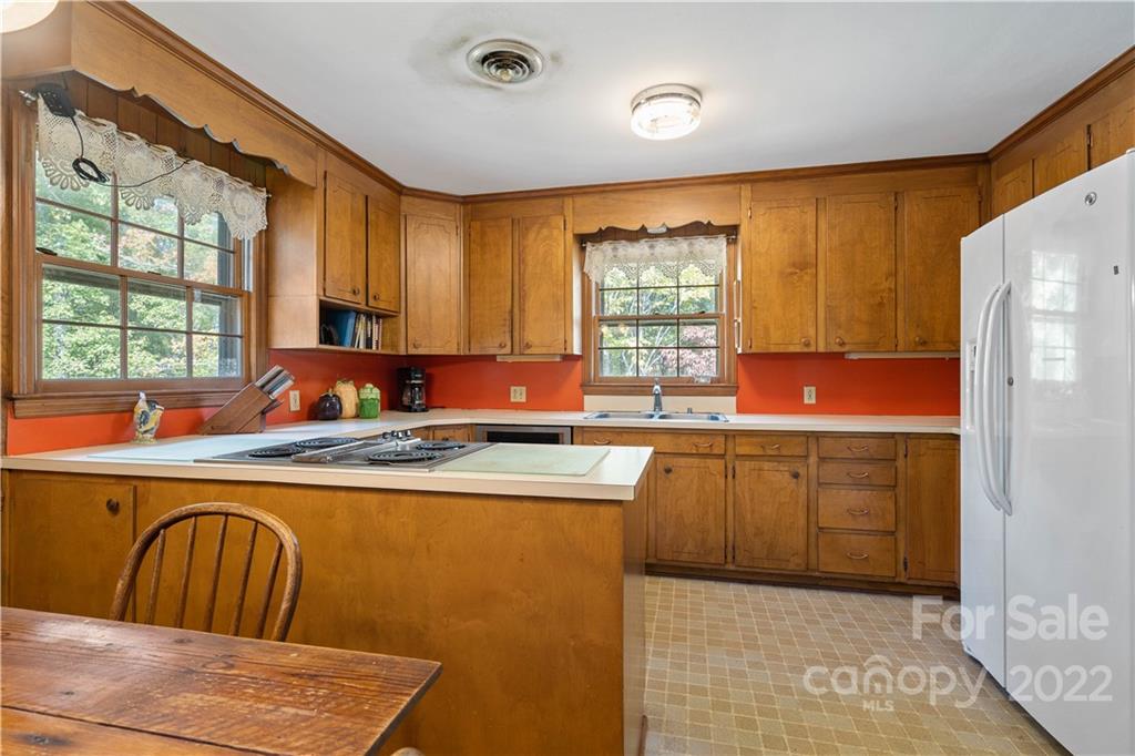 4289 Tabernacle Road Lancaster, SC 29720 - Photo 12 of 31 a kitchen with stainless steel appliances granite countertop a sink a stove and refrigerator