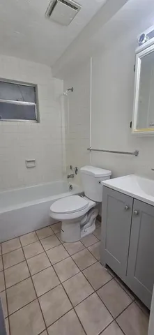 a bathroom with a sink a toilet and vanity