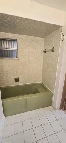 a bathroom with a sink vanity mirror and toilet