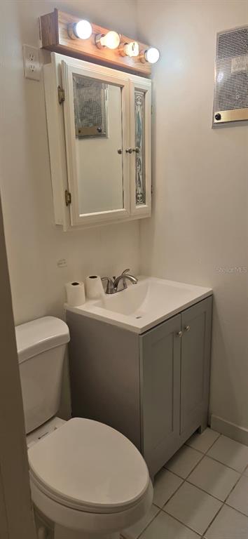 9060 Alan Boulevard Punta Gorda, FL 33982 - Photo 7 of 20 a bathroom with a sink vanity mirror and toilet