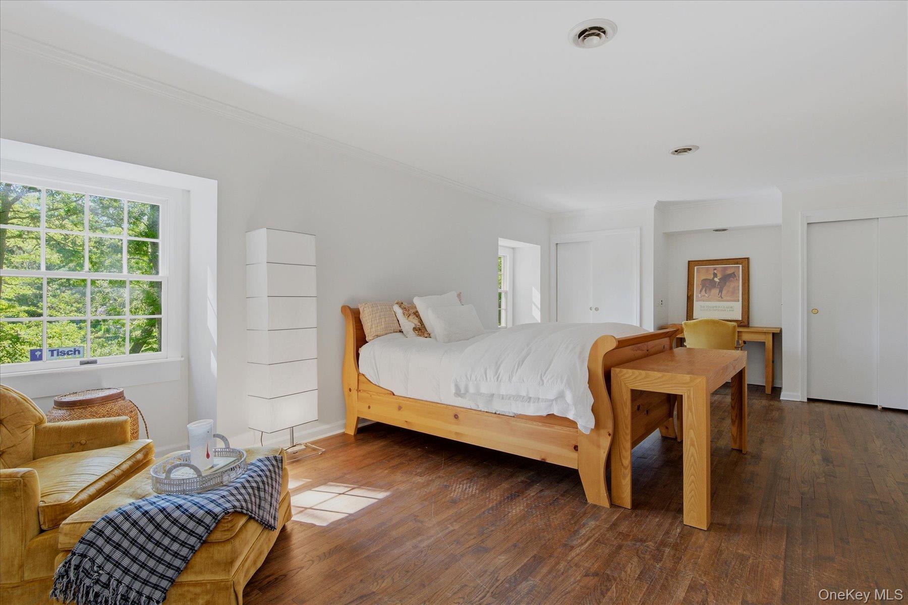 44 Georgica Close Road East Hampton, NY 11937 - Photo 23 of 28 a bedroom with a bed and a chair