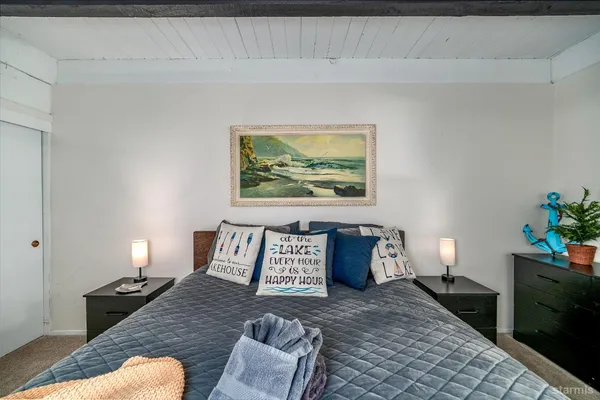 a bedroom with furniture and a lamp