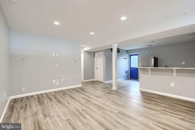 a kitchen with granite countertop a sink and cabinets