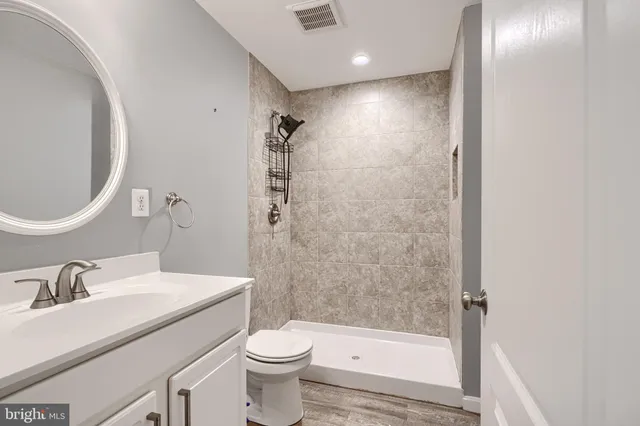 a view of room with wooden floor