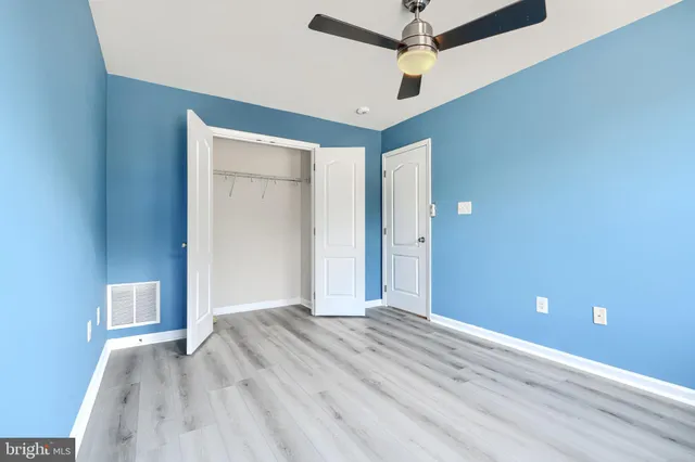 a bathroom with a double vanity sink toilet mirror and bathtub