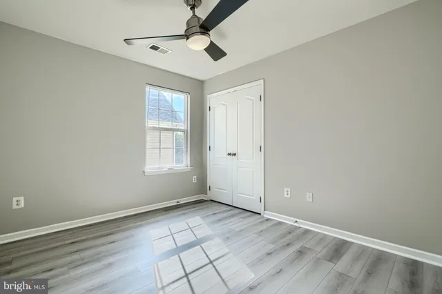 a bathroom with a sink a mirror and a shower