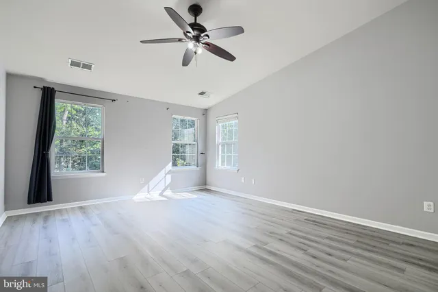 a bathroom with a tub and shower