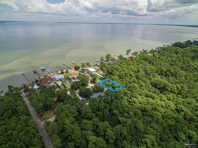 a view of a lake with a yard