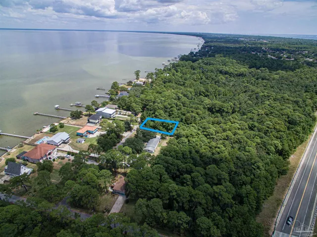 a bathroom with mirror and shower