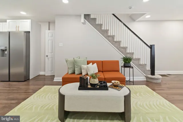 a bed room with furniture and wooden floor