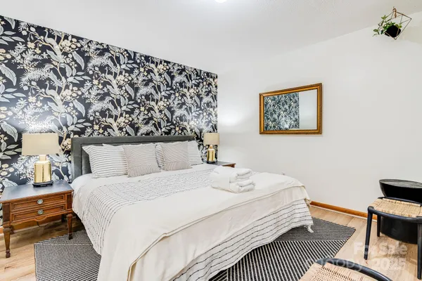 a bedroom with a bed and a couch