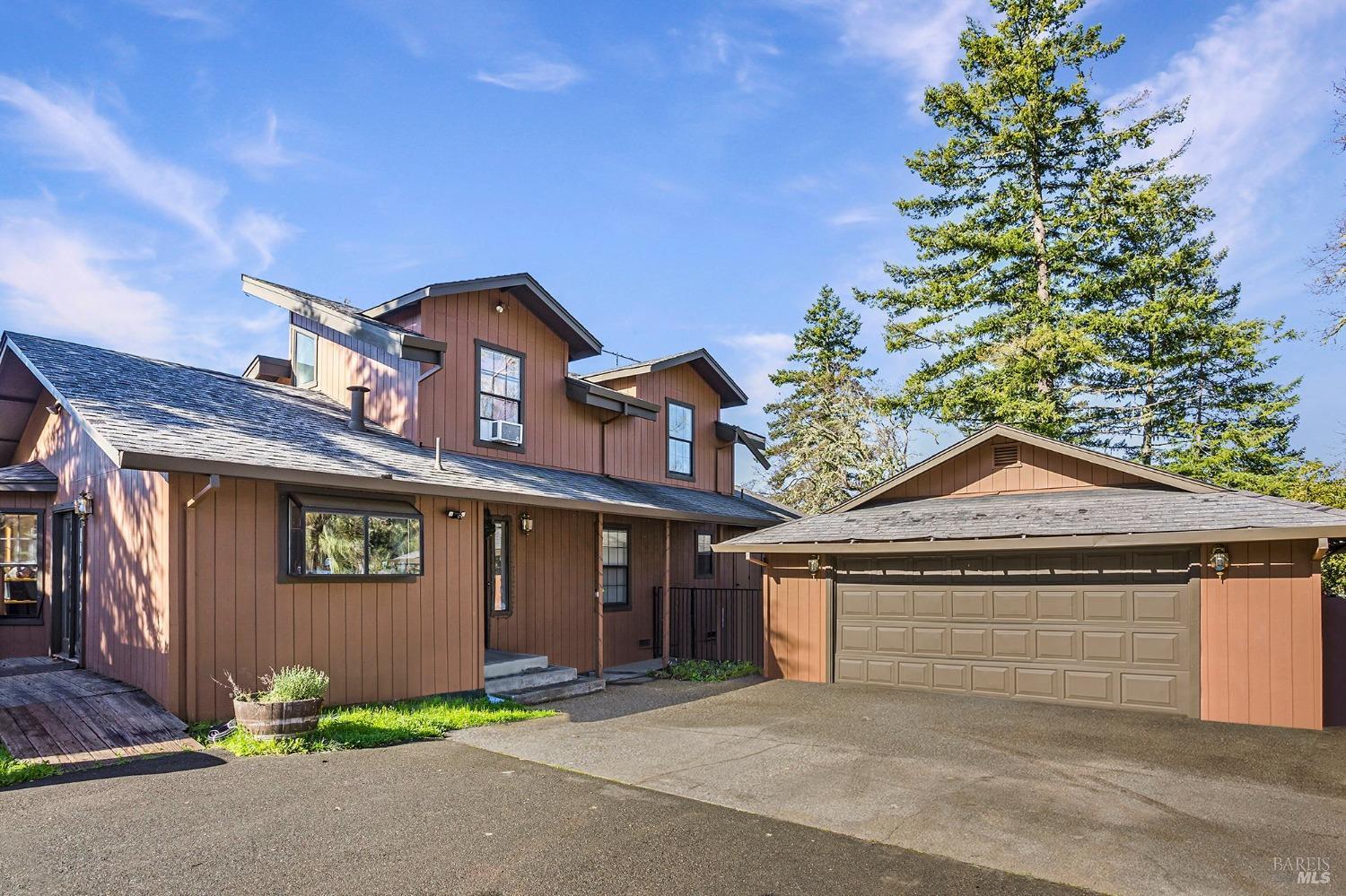 3160 Ridgewood Road Willits, CA 95490 - Photo 1 of 1 a front view of a house with garage