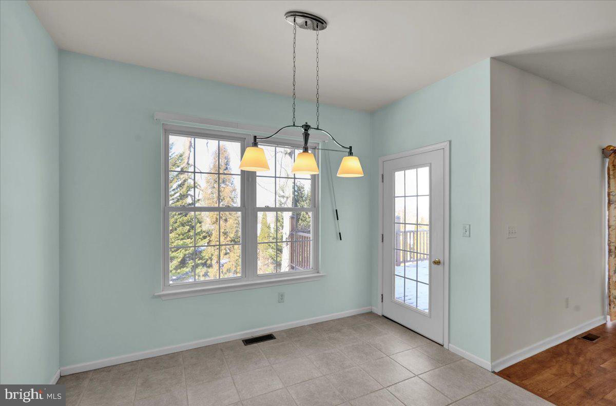 902 Bedford Avenue Reading, PA 19607 - Photo 15 of 48 a view of an empty room with windows and cabinet