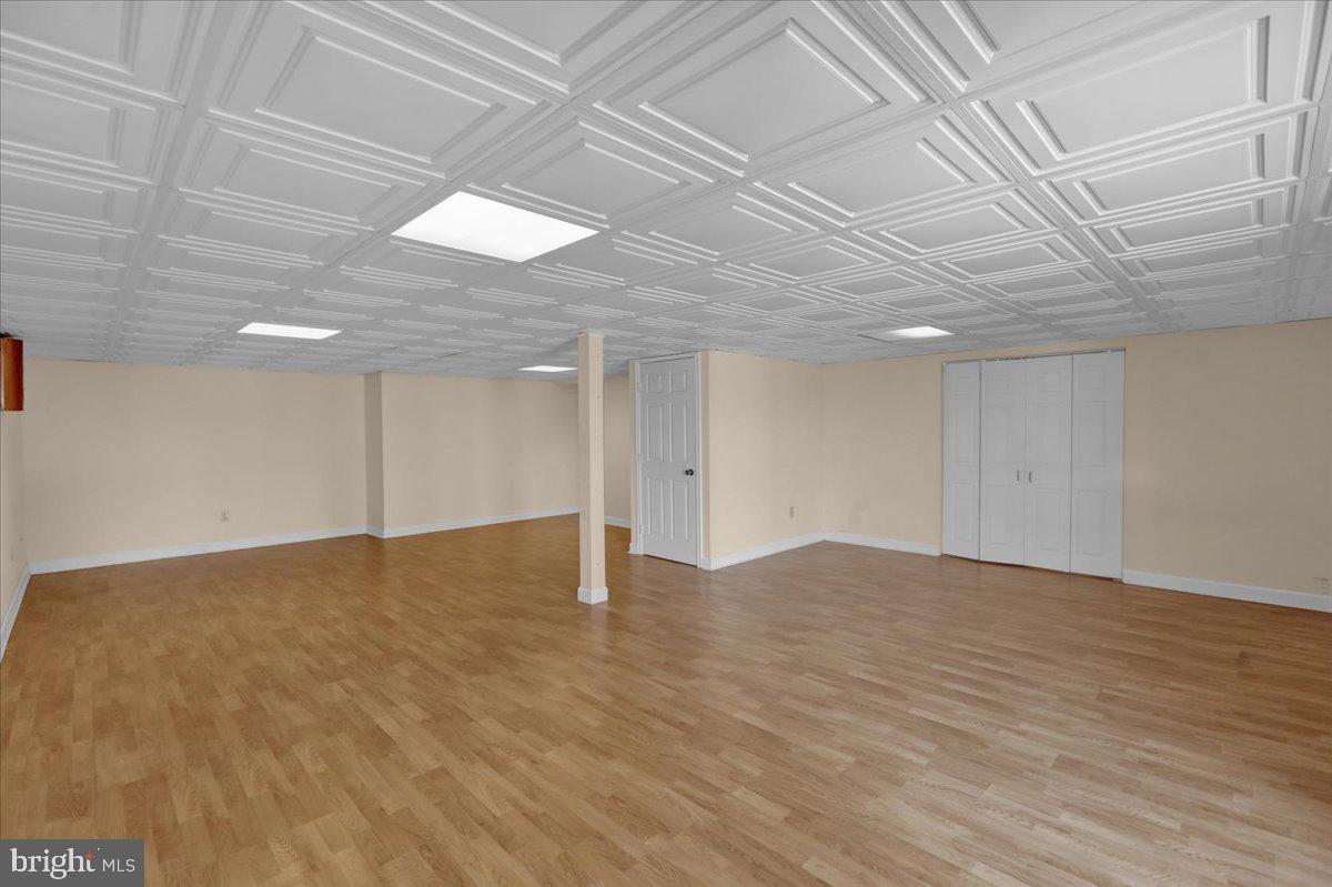 902 Bedford Avenue Reading, PA 19607 - Photo 41 of 48 a view of an empty room with wooden floor