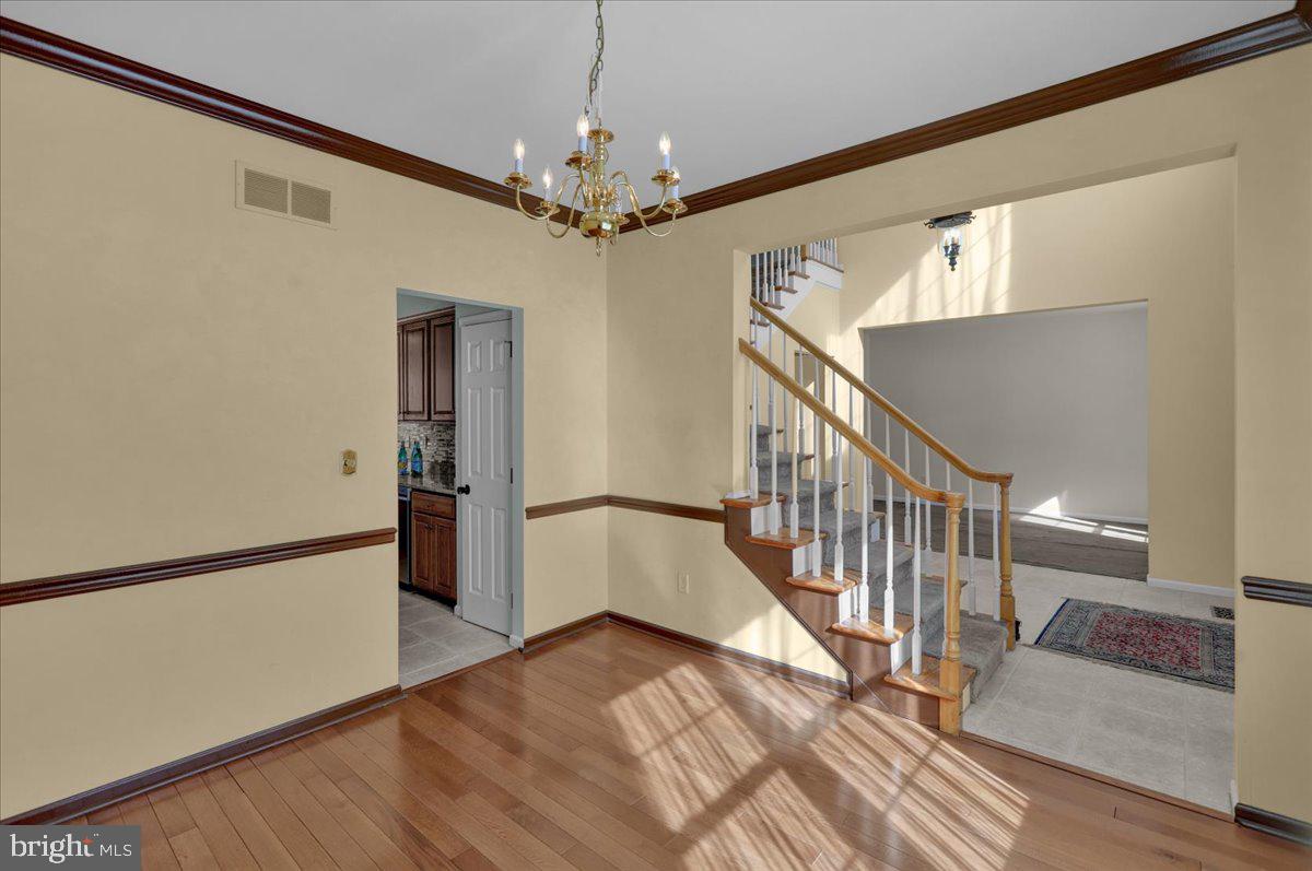 902 Bedford Avenue Reading, PA 19607 - Photo 10 of 48 a view of a livingroom with wooden floor and stairs