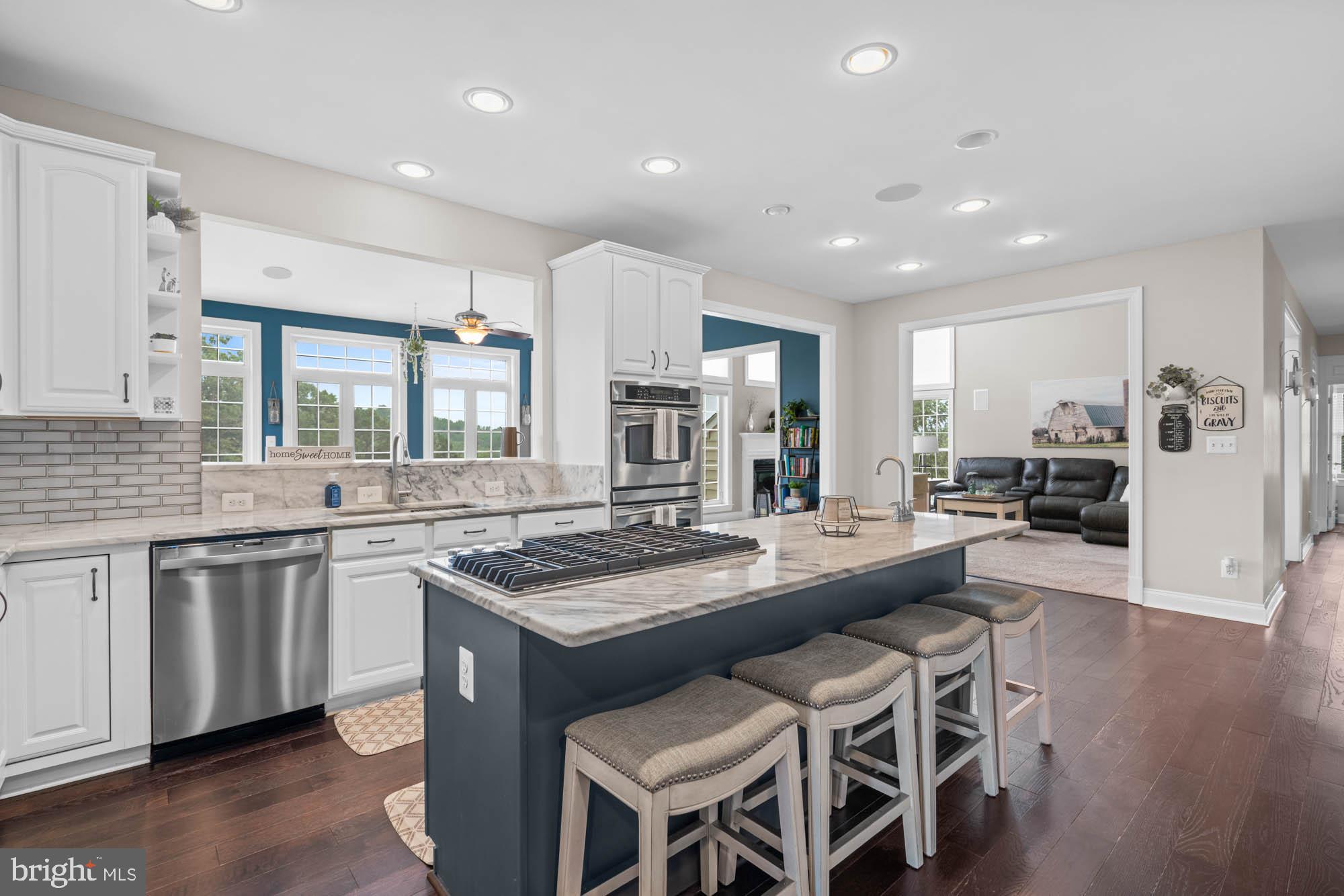 9163 Old Waterloo Road Warrenton, VA 20186 - Photo 11 of 73 a kitchen with granite countertop a sink and stove