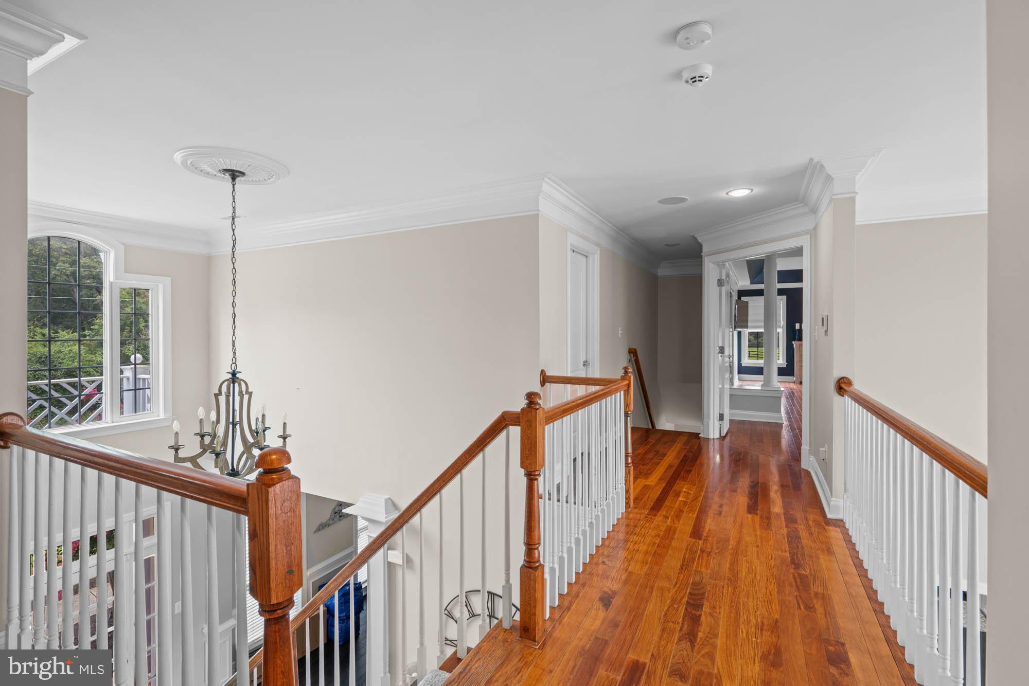 9163 Old Waterloo Road Warrenton, VA 20186 - Photo 20 of 73 a view of a hallway with wooden floor and stairs