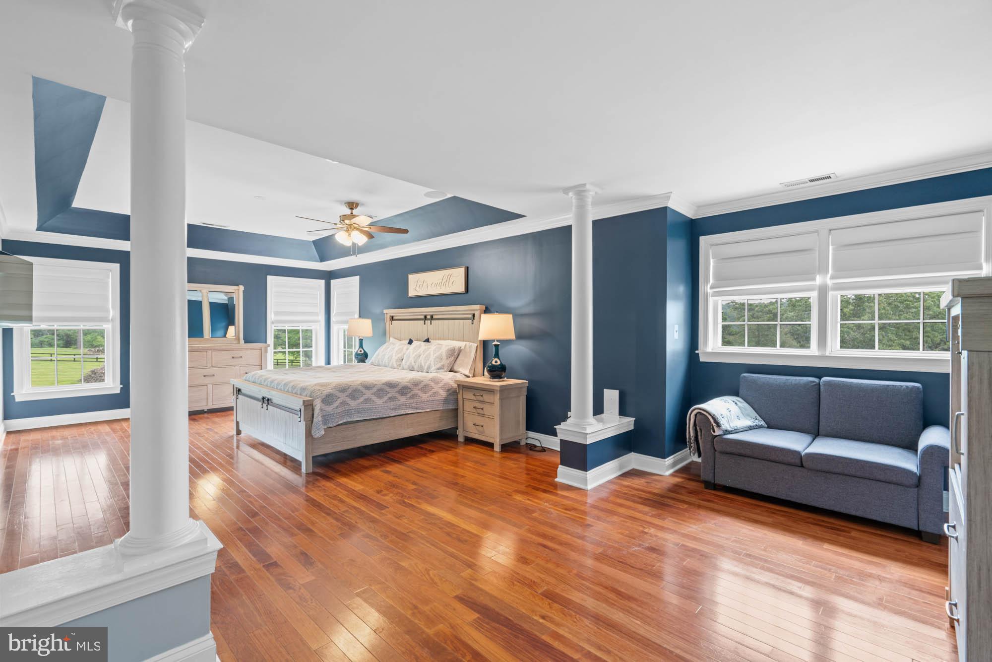 9163 Old Waterloo Road Warrenton, VA 20186 - Photo 21 of 73 a bedroom with furniture and a large window