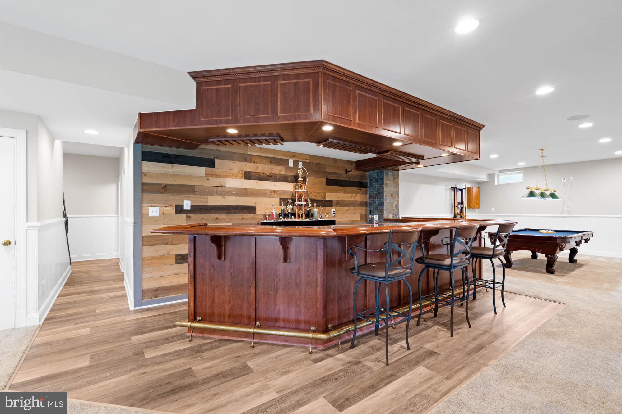 9163 Old Waterloo Road Warrenton, VA 20186 - Photo 34 of 73 a kitchen with stainless steel appliances granite countertop a stove a sink and a refrigerator