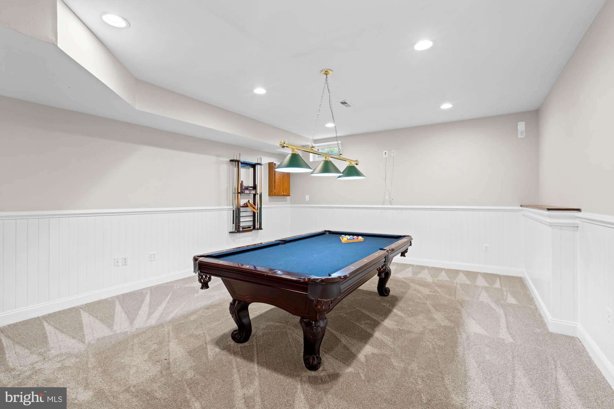 9163 Old Waterloo Road Warrenton, VA 20186 - Photo 37 of 73 a room with wooden floor and pool table