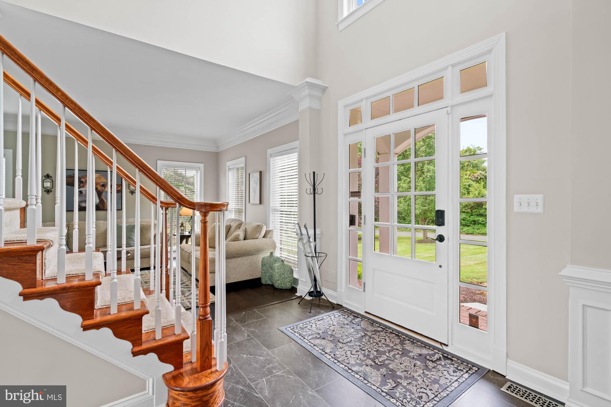 9163 Old Waterloo Road Warrenton, VA 20186 - Photo 4 of 73 a view of an entryway with wooden floor and windows