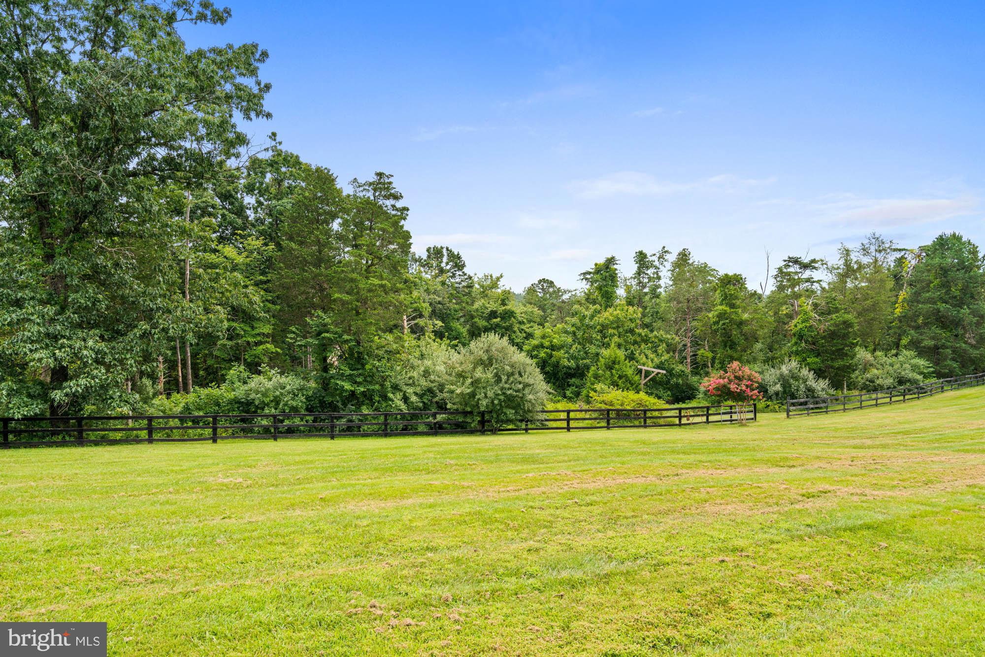 9163 Old Waterloo Road Warrenton, VA 20186 - Photo 55 of 73 a view of a swimming pool with an outdoor space and seating area