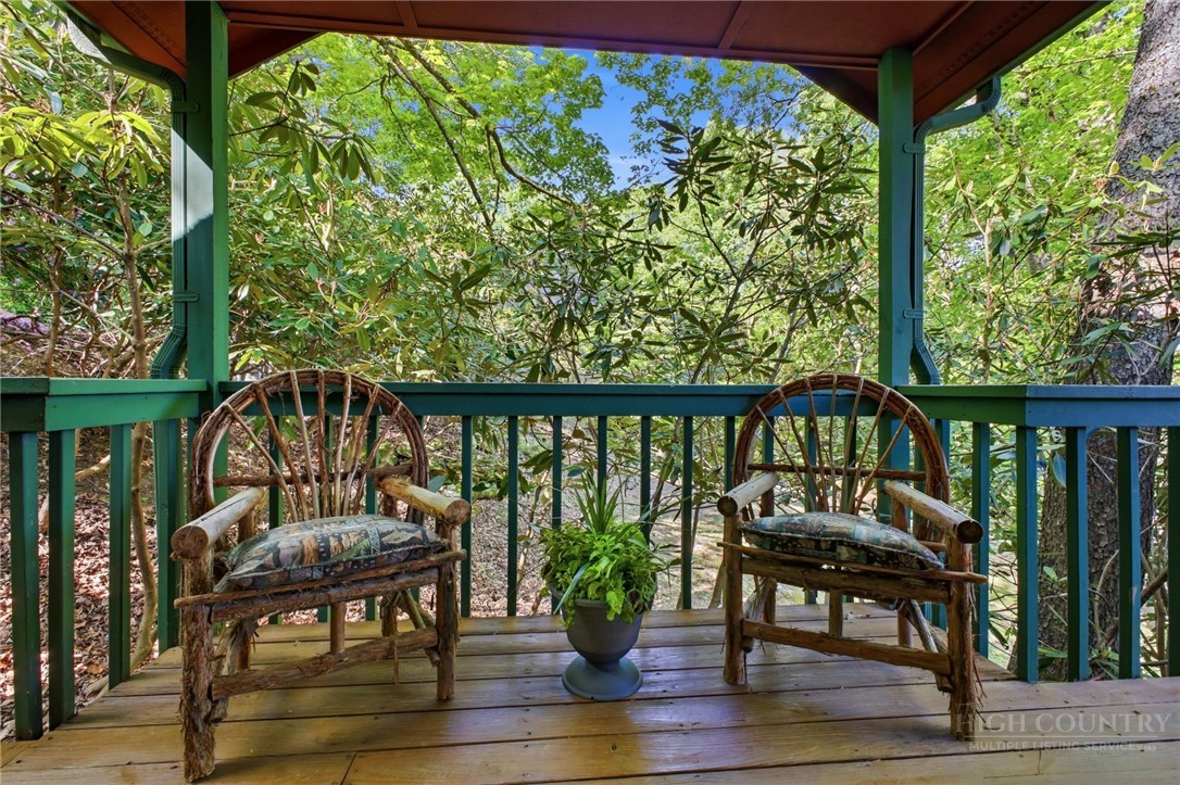 140 Lindale Ridge, Unit 504 Boone, NC 28607 - Photo 11 of 15 a view of a chairs and table on the deck