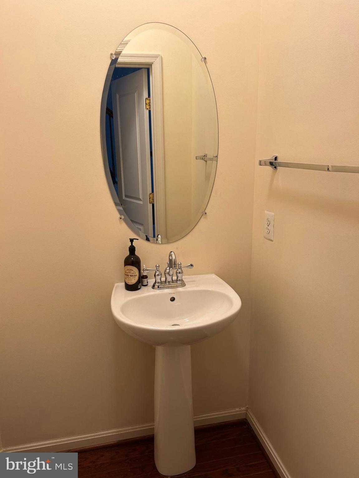 11912 Benton Lake Road Bristow, VA 20136 - Photo 14 of 36 a bathroom with a sink and mirror