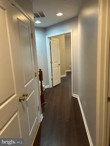 a bath tub sitting in a bathroom next to a window