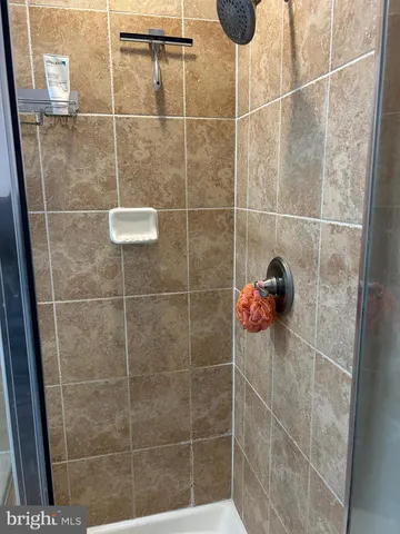 a wooden bench sitting on top of a wooden fence