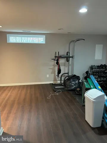 a view of room with hardwood floor