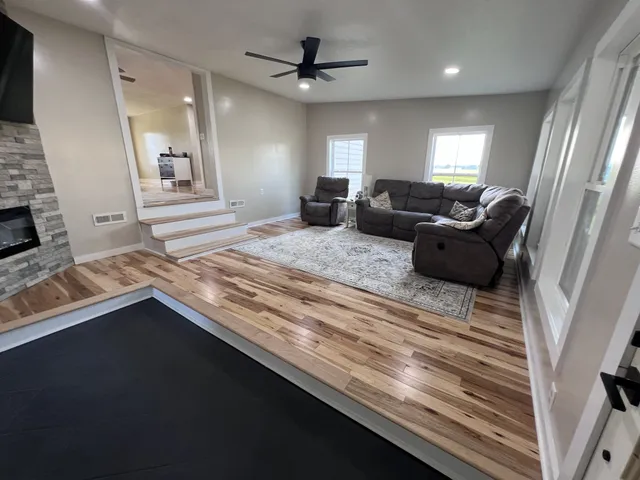 a living room with granite countertop furniture and a fireplace