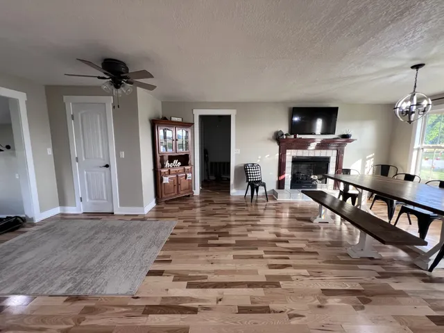 a view of livingroom with furniture flat screen tv and staircase