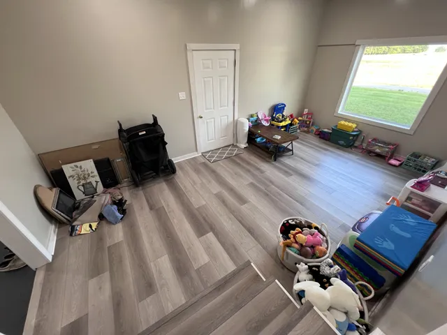 a room with furniture and a wooden floor