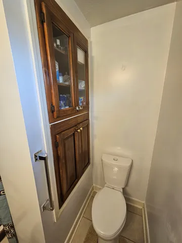 a view of a kitchen with wooden floor and electronic appliances