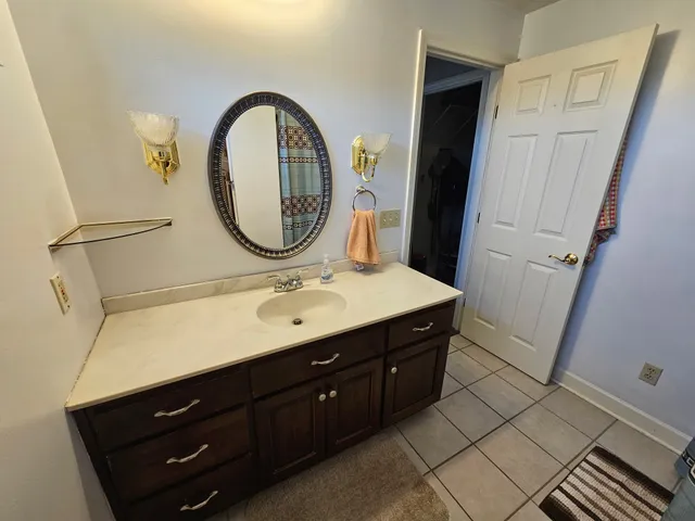 a living room with furniture a rug and a chandelier