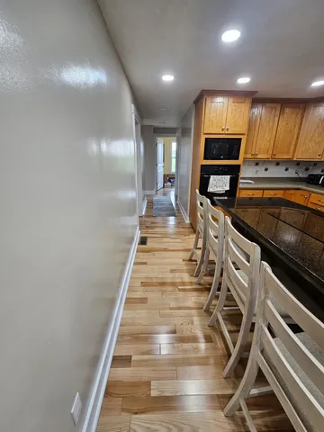 a bed room with a bed and a chandelier