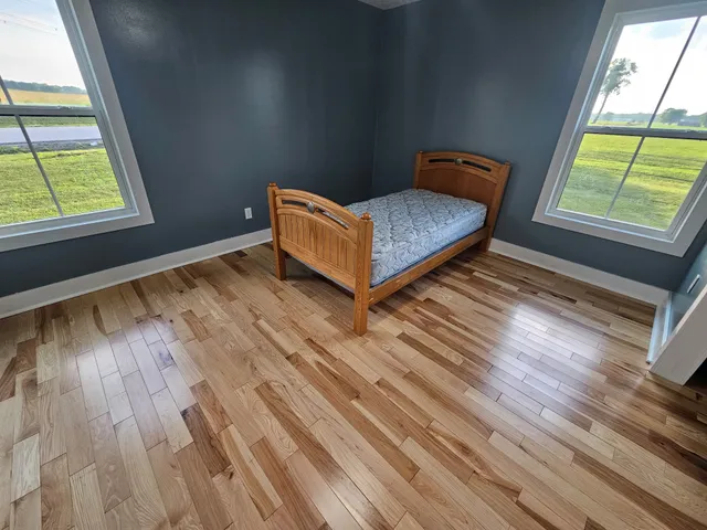 a bed room with a bed and a book shelf