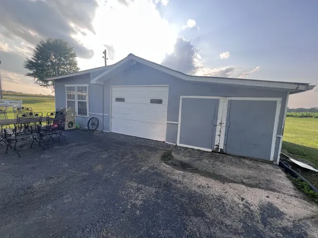 a view of a house with backyard and a sink