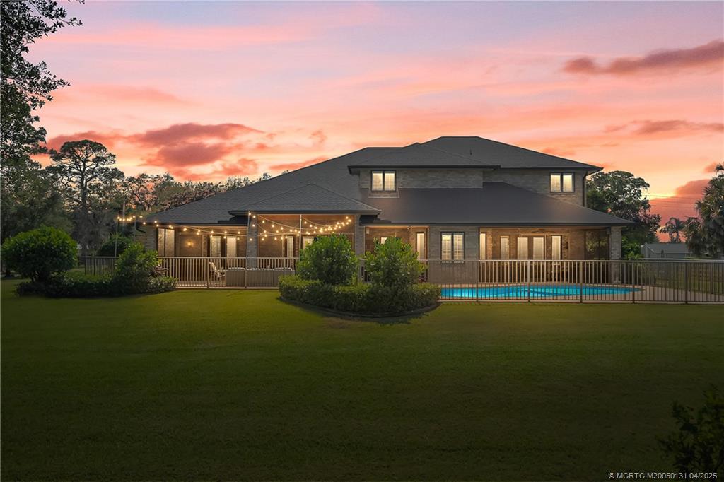 6655 Southwest Gaines Avenue Stuart, FL 34997 - Photo 12 of 48 a front view of a house with garden