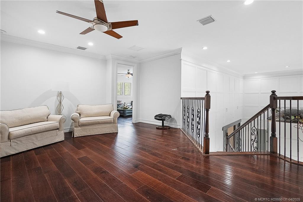 6655 Southwest Gaines Avenue Stuart, FL 34997 - Photo 30 of 48 a living room with furniture and a wooden floor