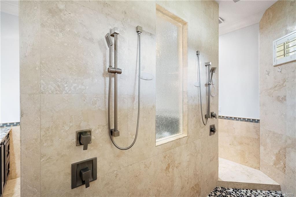 6655 Southwest Gaines Avenue Stuart, FL 34997 - Photo 34 of 48 a bathroom with a shower