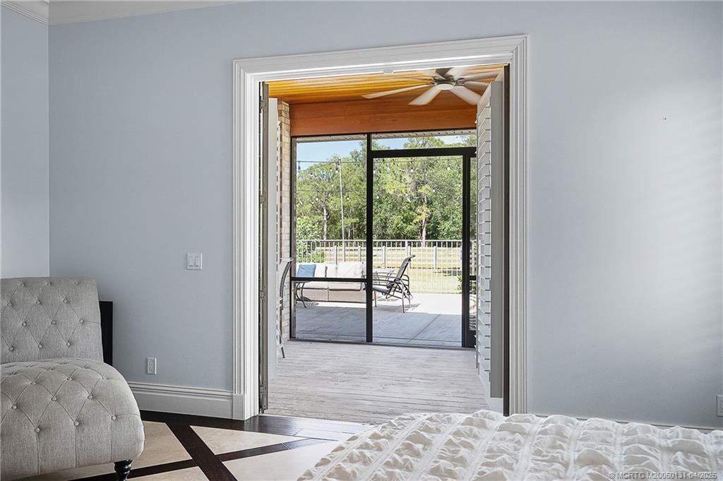 6655 Southwest Gaines Avenue Stuart, FL 34997 - Photo 35 of 48 a view of a room that has a bed in it