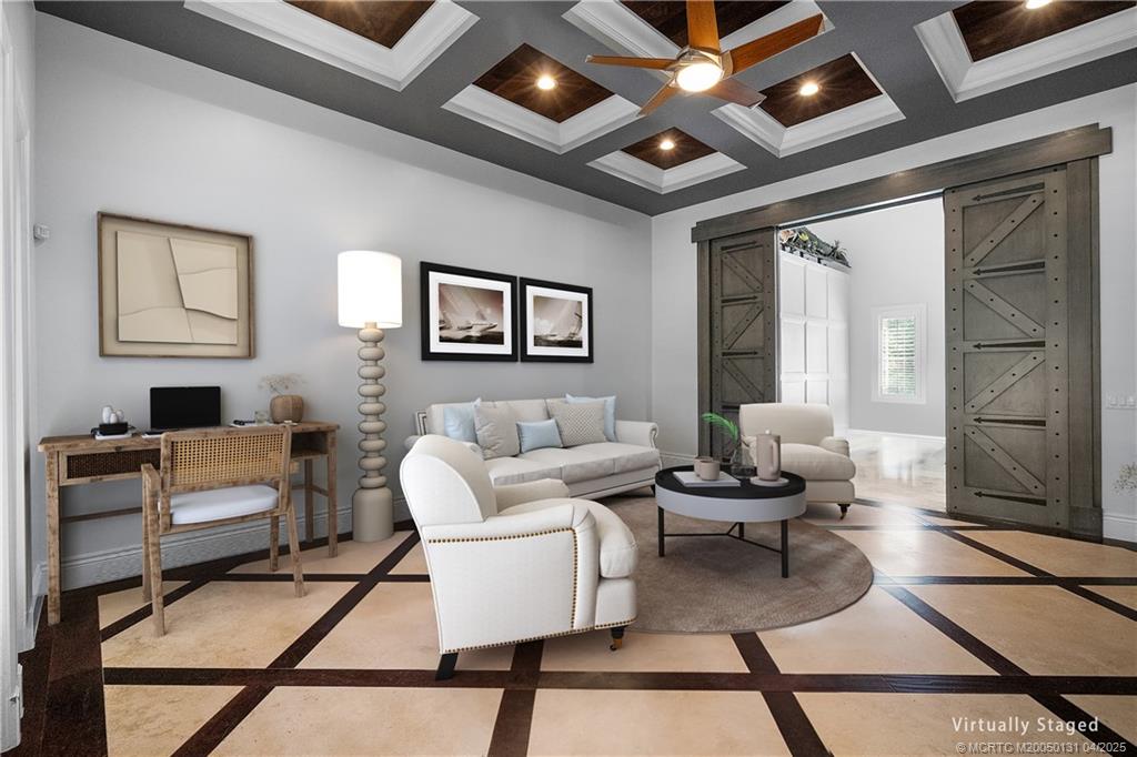 6655 Southwest Gaines Avenue Stuart, FL 34997 - Photo 10 of 48 a living room with furniture a rug and a table