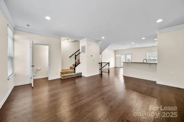 a view of a kitchen with a sink and a floor to ceiling window