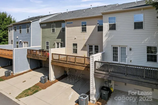 a view of a house with a balcony and a dining table