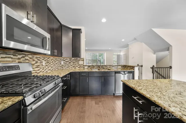 a kitchen with a stove and a sink