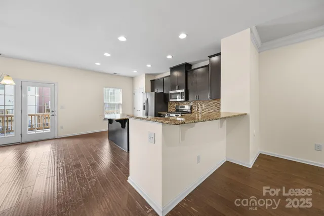 a view of kitchen with wooden floor