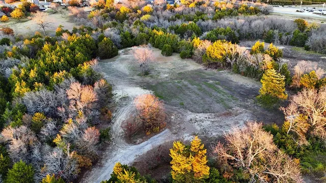 a view of a town with mountains in the background